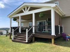 a house with a covered porch and stairs