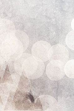 an abstract background with white circles and blurry lights in the foreground, on top of a gray textured surface