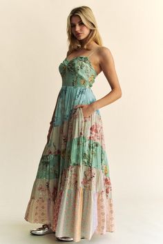 Cotton/Rayon This enchanting tiered floral maxi dress exudes whimsy and charm with its mix of pastel blues, pinks, and greens. The adjustable spaghetti straps and sweetheart neckline offer a delicate touch, while the smocked bodice ensures a comfortable and flattering fit. The flowing tiers create a dreamy silhouette, perfect for twirling through garden parties or romantic evenings. Plus, it features convenient pockets, blending practicality with its magical, fairy-tale feel. Style with your fav Textured Maxi Dress, Vibe Tribe, Tiered Maxi Dress, Summer Floral, Printed Maxi, Mixing Prints, Looks Vintage, Floral Maxi, Printed Maxi Dress