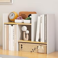 a bookshelf with various items on it and a clock in the corner next to them