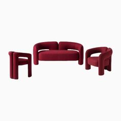 three pieces of furniture in red velvet, with one chair and two stools on each side