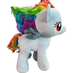 a small stuffed pony with multicolored hair