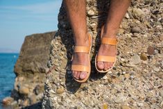 "Super fast 1-4 days delivery to the US and Europe with DHL express shipping available at checkout! Please add a note with your phone number at checkout. Mens leather sandals made by 100% genuine leather. Greek leather sandals. Open toe with two wide pararell straps, with adjustable ankle strap. Unisex sandals , suitable for both women and men. Non- slip rubber sole. Handcrafted in Greece. Natural tan color. Please note that the color of the sandal will eventually get darker over time. Also, due Jesus Sandals, Mens Shoes Sandals, Men Sandals, Leather Ideas, Mens Leather Sandals, Handmade Sandals, Tan Sandals, Slingback Flats, Leather Sandals Flat