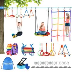 children's toys and accessories are hanging on the tree limbples, swings, climbing bars, backpacks