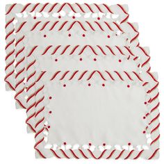 four red and white paper napkins with candy cane designs on the edges, set of six