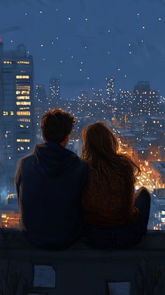 two people sitting on top of a building looking at the city lights in the distance