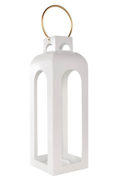 a white candle holder with a gold ring on the top and an oval handle at the bottom