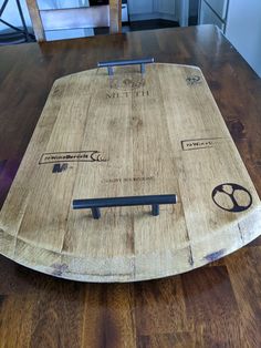 a wooden board sitting on top of a hard wood floor