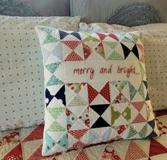 a pillow that says merry and bright on it