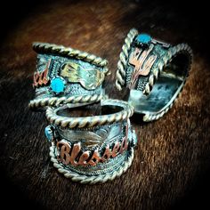 Discover the handcrafted Blessed Ring, a stunning piece that adds elegance and meaning to your style—perfect for layering or wearing solo. Custom Belt Buckles, Martini Set, Katherine Kelly, Rodeo Queen, Tie Necklace, Custom Belt, Western Jewelry, Custom Products, Cuff Earrings