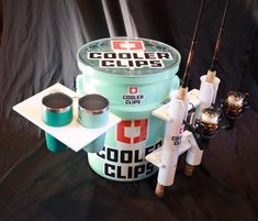 an assortment of fishing equipment is displayed on a black background with the words cooler clips above it