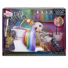 the doll is sitting on the toilet with her hair and makeup products in front of it