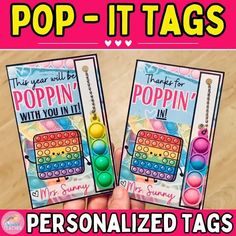 two pop - it tags with the words poppin'with you in each one