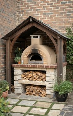 an outdoor pizza oven with wood stacked in it