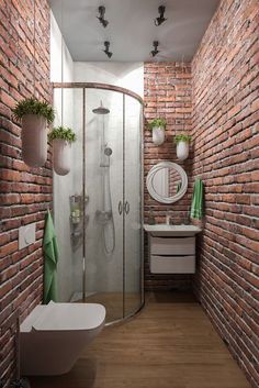 a bathroom with red brick walls and a white bathtub next to a stand up shower