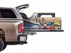 the back end of a pickup truck loaded with lumber