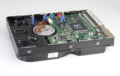 the inside of a hard drive with several small figures on it