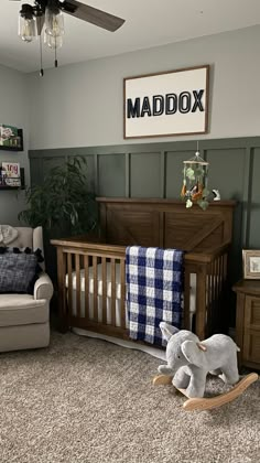 a baby's room with a rocking chair, crib and other furniture in it