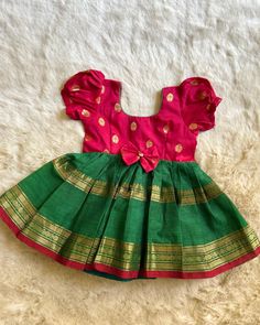 Simple yet traditional! The timeless trend! Red with Bottle Green (Bow)- Kanchi Cotton South Indian Ethnic Frock for Baby Girl Instock: 0-3 Years www.babynmeindia.com 🔎REDGREBOWKCFRO Traditional Frocks, Baby Girl Dresses Indian, Frock For Baby Girl, Baby Lehenga, Frocks For Babies, Ikat Blouse, Frocks For Kids