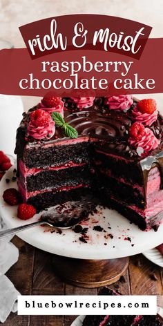 a chocolate cake with raspberries on top and the words rich & moist raspberry chocolate cake above it