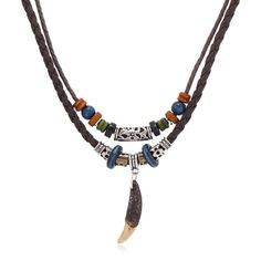 a necklace with two different beads and a feather charm