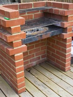 an outdoor bbq grill made out of bricks