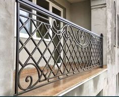 an iron balcony railing on the outside of a house