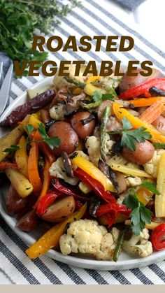 roasted vegetables in a white bowl on a table with text overlay that reads roasted vegetables