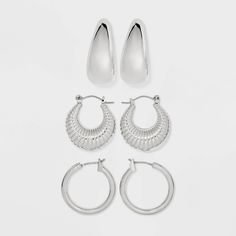 Enjoy your day in style with the Tube/Shrimp/Wide Hoop Earring Set from Universal Thread™. This silver-tone hoop earring set includes one pair in a tube design, one in a shrimp design and one in a wide hoop shape to give your options. Designed with clip-in clasp and post-back closures for a nice fit, these nickel-free earrings suit most skin types. Universal Thread™: Found exclusively at Target. Affordable Nickel-free Circular Hoop Earrings, Nickel-free Sterling Silver Hoop Earrings, Spiral Nickel-free Metal Hoop Earrings, Nickel-free Silver Spiral Hoop Earrings, Nickel-free Hoop Clip-on Earrings In Sterling Silver, Nickel Free Earrings, Hammered Metal, Hoop Earring Sets, Accessories Jewelry Earrings