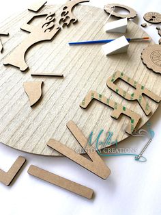 a clock made out of wood with various shapes and sizes