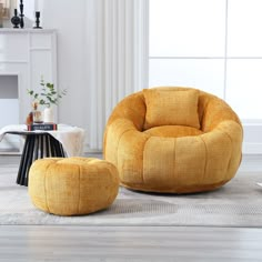 a yellow chair and ottoman in a living room