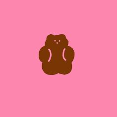 a brown teddy bear on a pink background