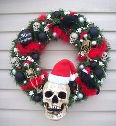 a wreath decorated with skulls and christmas decorations