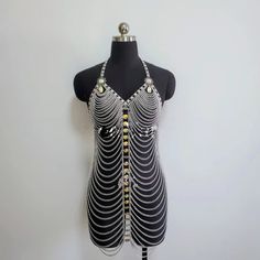 This Luxury Chain Dress from Primadons and Donnas is ready to ship and will take 1 business day processing time. The fabric type is worsted and the dress type is a club dress. The material is metal and the chains are adjustable for different sizing. If you need to expedite your order, please start a chat with us. We will be happy to help. Body Chain Dress, Music Festival Dress, Burning Man Accessories, Rhinestone Body Chain, Body Chain Harness, Chain Harness, Rave Costumes, Bodysuit Tops, Burning Man Outfits