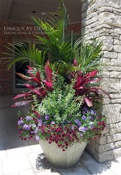 a large planter filled with lots of colorful flowers