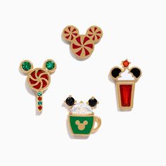 three mickey mouse pins and a starbucks drink pin set on a white background with red, green, and yellow accents