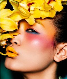 a woman with yellow flowers on her head