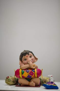 a figurine sitting on top of a table