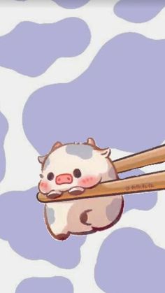 a cartoon pig holding two chopsticks in it's mouth