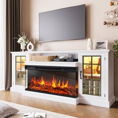 a living room with a television and fire place in the fireplace, it looks like an entertainment center