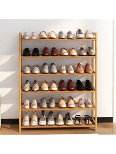 there are many pairs of shoes on the shelf