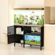 a fish tank sitting on top of a black cabinet