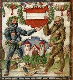 two men in costumes are talking to each other on a mosaic tile wall with christmas decorations around them