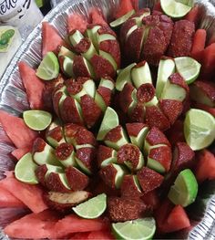 a platter filled with watermelon and lime slices