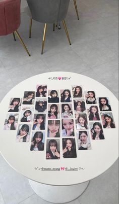 a table with many pictures on it in front of two chairs and one has a pink chair