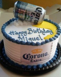 a birthday cake with a can of corona beer on top