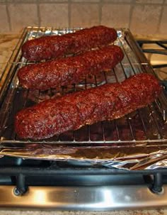 some meat is cooking on a grill in the oven and it's ready to be cooked