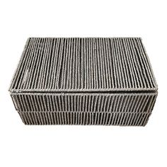 a gray wicker box on a white background