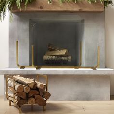 a fireplace with logs stacked on top of it