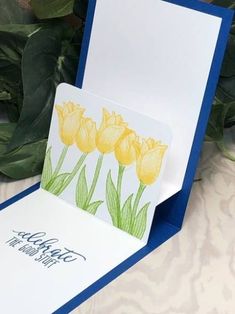 a card with yellow tulips on it